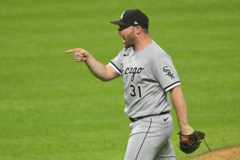 Jul 13, 2022; Cleveland, Ohio, USA; Chicago White Sox relief pitcher Liam Hendriks (31) celebrates a win over the Cleveland Guardians at Progressive Field. Mandatory Credit: David Richard-USA TODAY Sports