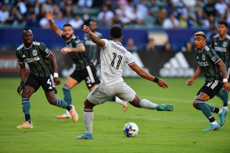 Jul 13, 2022; Carson, California, USA; San Jose Earthquakes forward Jeremy Ebobisse (11) takes a shot on goal to score against the Los Angeles Galaxy during the first half at Dignity Health Sports Park. Mandatory Credit: Gary A. Vasquez-USA TODAY Sports