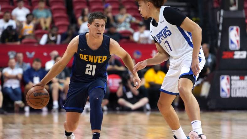 Jul 13, 2022; Las Vegas, NV, USA; Denver Nuggets guard Collin Gillespie (21) dribbles against LA Clippers guard Jason Preston (17) during an NBA Summer League game at Thomas & Mack Center. Mandatory Credit: Stephen R. Sylvanie-USA TODAY Sports