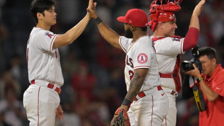Jul 13, 2022; Anaheim, California, USA; Los Angeles Angels starting pitcher Shohei Ohtani (17) gets a high five from second baseman Luis Rengifo (2) after defeating the Houston Astros at Angel Stadium. Mandatory Credit: Jayne Kamin-Oncea-USA TODAY Sports