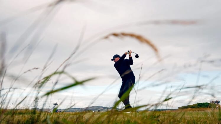 Jul 14, 2022; St. Andrews, SCT; Phil Mickelson tees off on the 17th hole during the first round of the 150th Open Championship golf tournament at St. Andrews Old Course. Mandatory Credit: Rob Schumacher-USA TODAY Sports