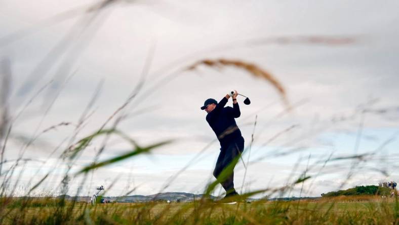 Jul 14, 2022; St. Andrews, SCT; Phil Mickelson tees off on the 17th hole during the first round of the 150th Open Championship golf tournament at St. Andrews Old Course. Mandatory Credit: Rob Schumacher-USA TODAY Sports