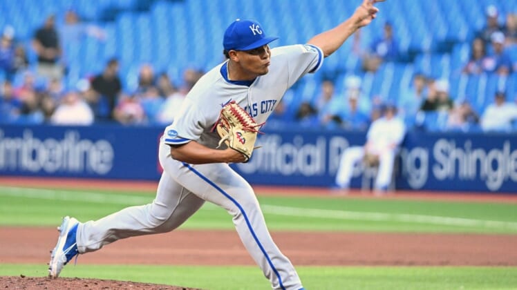 Jul 14, 2022; Toronto, Ontario, CAN;  Kansas City Royals starting pitcher Angel Zerpa (61) delivers a pitch against the Toronto Blue Jays in the first inning at Rogers Centre. Mandatory Credit: Dan Hamilton-USA TODAY Sports