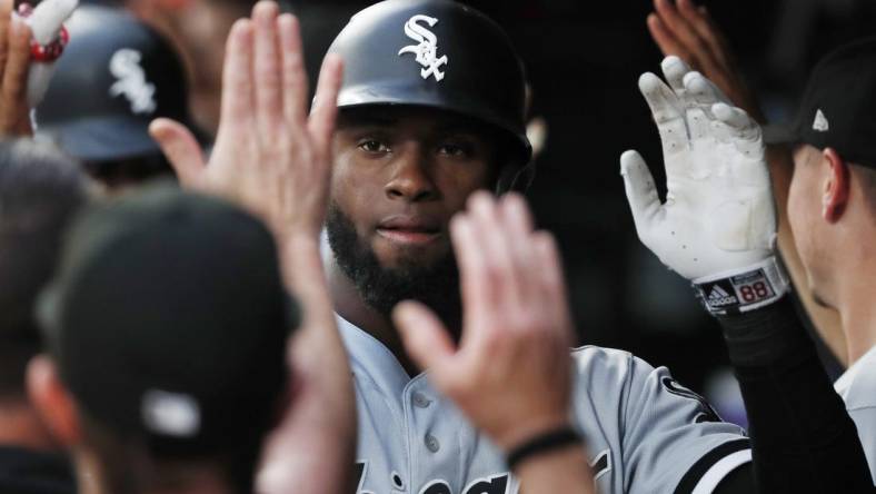 Jul 14, 2022; Minneapolis, Minnesota, USA; Chicago White Sox center fielder Luis Robert (88) celebrates his grand slam home run against the Minnesota Twins in the fourth inning at Target Field. Mandatory Credit: Bruce Kluckhohn-USA TODAY Sports