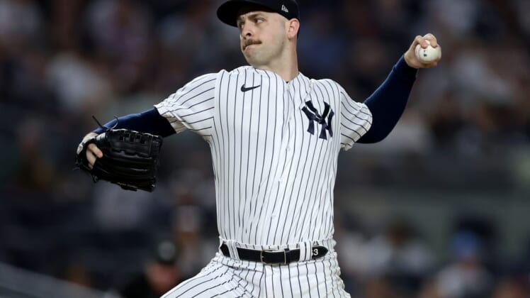 Jul 14, 2022; Bronx, New York, USA; New York Yankees relief pitcher Lucas Luetge (63) pitches against the Cincinnati Reds during the tenth inning at Yankee Stadium. Mandatory Credit: Brad Penner-USA TODAY Sports
