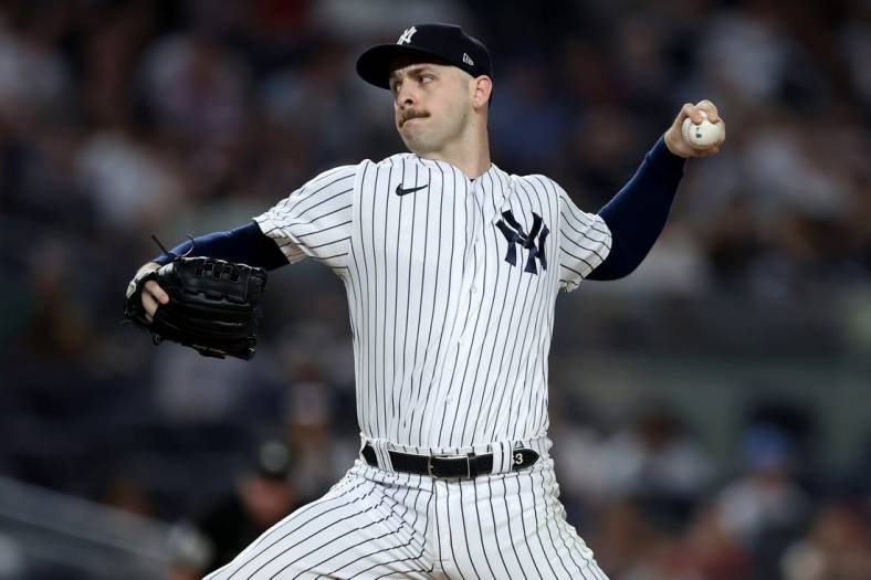 Jul 14, 2022; Bronx, New York, USA; New York Yankees relief pitcher Lucas Luetge (63) pitches against the Cincinnati Reds during the tenth inning at Yankee Stadium. Mandatory Credit: Brad Penner-USA TODAY Sports