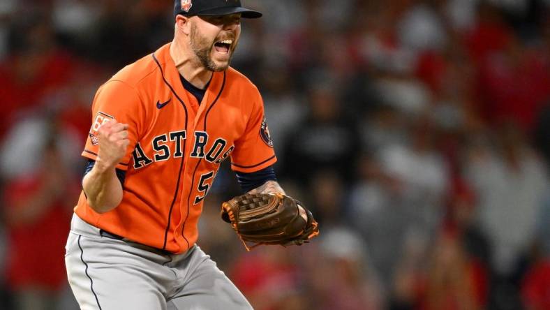 Jul 14, 2022; Anaheim, California, USA;   Houston Astros relief pitcher Ryan Pressly (55) celebrates after striking out Los Angeles Angels left fielder Brandon Marsh (16) and earning a win in the 10th inning at Angel Stadium. Mandatory Credit: Jayne Kamin-Oncea-USA TODAY Sports