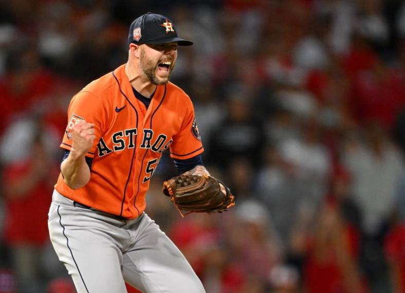 Jul 14, 2022; Anaheim, California, USA;   Houston Astros relief pitcher Ryan Pressly (55) celebrates after striking out Los Angeles Angels left fielder Brandon Marsh (16) and earning a win in the 10th inning at Angel Stadium. Mandatory Credit: Jayne Kamin-Oncea-USA TODAY Sports