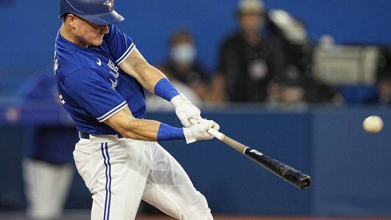 Jul 15, 2022; Toronto, Ontario, CAN; Toronto Blue Jays third baseman Matt Chapman (26) hits a three run home run against the Kansas City Royals during the fifth inning at Rogers Centre. Mandatory Credit: John E. Sokolowski-USA TODAY Sports