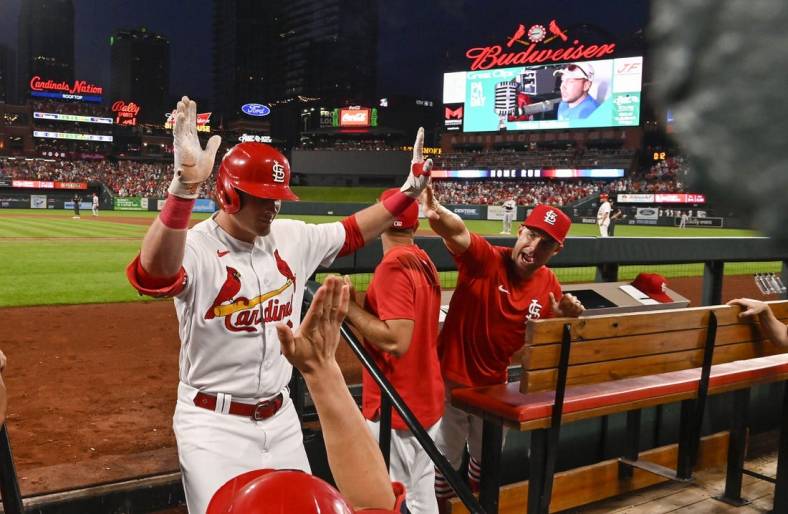 Jul 15, 2022; St. Louis, Missouri, USA;  St. Louis Cardinals designated hitter Nolan Gorman (16) is congratulated by bench coach Skip Schumaker (55) after hitting a solo home run against the Cincinnati Reds during the fourth inning at Busch Stadium. Mandatory Credit: Jeff Curry-USA TODAY Sports