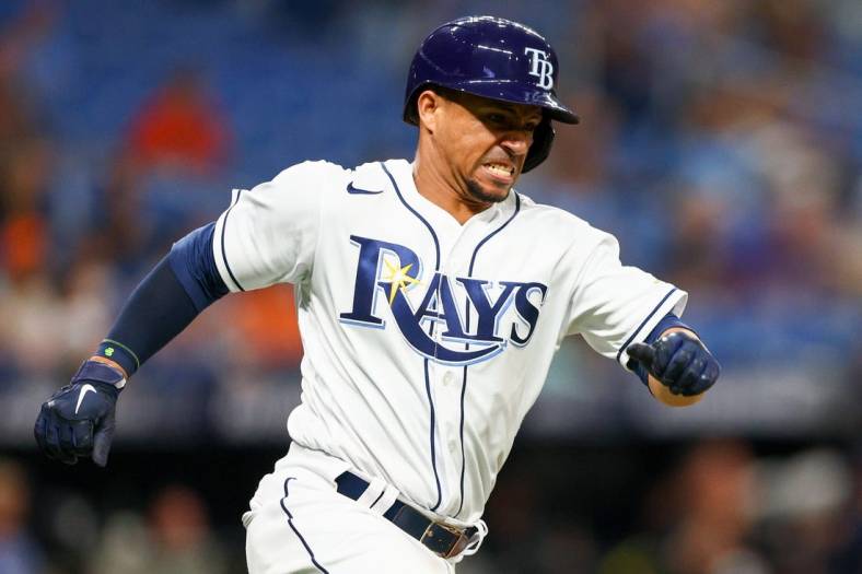 Jul 15, 2022; St. Petersburg, Florida, USA;  Tampa Bay Rays catcher Francisco Mejia (21) hits an RBI double against the Baltimore Orioles in the sixth inning at Tropicana Field. Mandatory Credit: Nathan Ray Seebeck-USA TODAY Sports