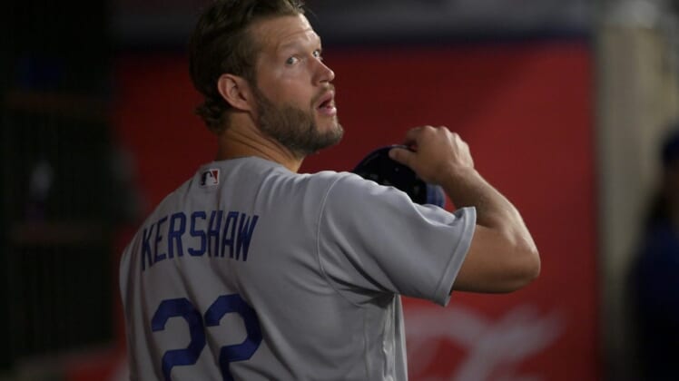 Jul 15, 2022; Anaheim, California, USA;  Los Angeles Dodgers starting pitcher Clayton Kershaw (22) waits in the dugout during the fifth inning against the Los Angeles Angels at Angel Stadium. Mandatory Credit: Jayne Kamin-Oncea-USA TODAY Sports