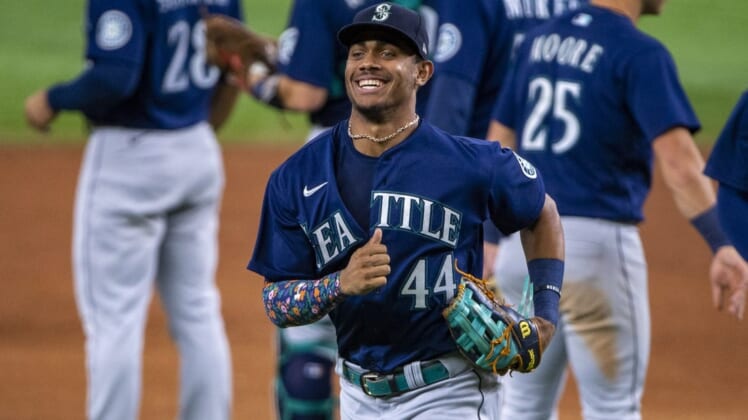 Jul 15, 2022; Arlington, Texas, USA; Seattle Mariners center fielder Julio Rodriguez (44) and the Mariners celebrate the win over the Texas Rangers at Globe Life Field. Mandatory Credit: Jerome Miron-USA TODAY Sports