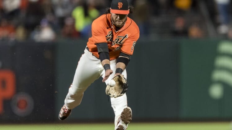 Jul 15, 2022; San Francisco, California, USA;  San Francisco Giants shortstop Brandon Crawford (35) fields a ground ball against the Milwaukee Brewers during the sixth inning at Oracle Park. Mandatory Credit: John Hefti-USA TODAY Sports