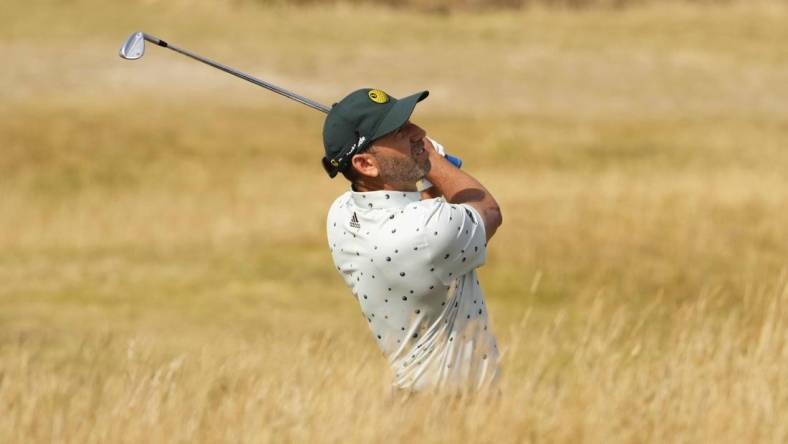 Jul 16, 2022; St. Andrews, SCT; Sergio Garcia plays his second shot on the 13th hole during the third round of the 150th Open Championship golf tournament. Mandatory Credit: Rob Schumacher-USA TODAY Sports