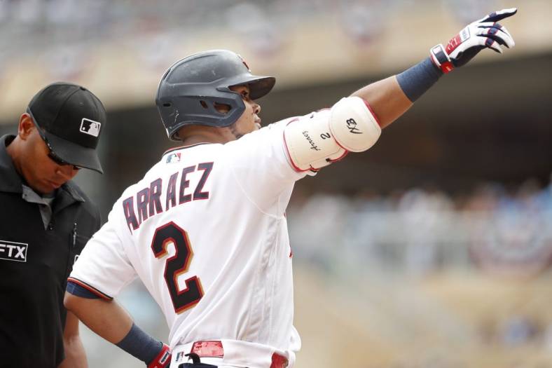 Jul 16, 2022; Minneapolis, Minnesota, USA; Minnesota Twins first baseman Luis Arraez (2) points to the crowd to celebrate his solo home run against the Chicago White Sox in the first inning at Target Field. Mandatory Credit: Bruce Kluckhohn-USA TODAY Sports