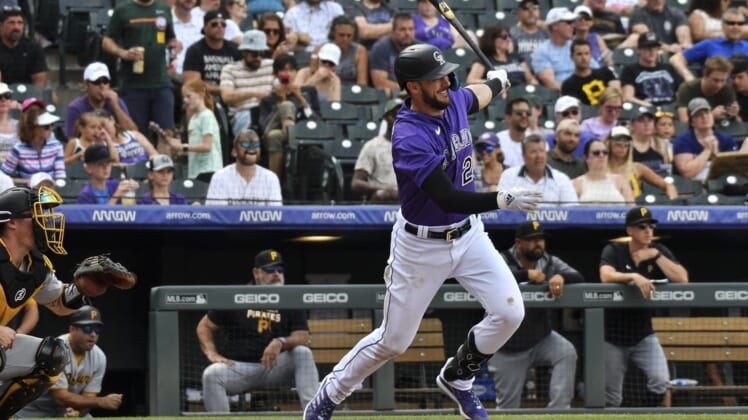 Jul 16, 2022; Denver, Colorado, USA; Colorado Rockies left fielder Kris Bryant (23) gets a base hit in the fifth inning against the Pittsburgh Pirates at Coors Field. Mandatory Credit: John Leyba-USA TODAY Sports