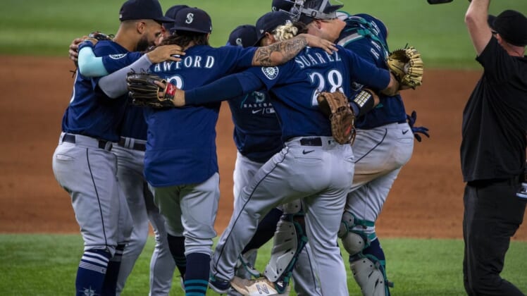 Jul 16, 2022; Arlington, Texas, USA; The Seattle Mariners celebrate the win over the Texas Rangers at Globe Life Field. Mandatory Credit: Jerome Miron-USA TODAY Sports