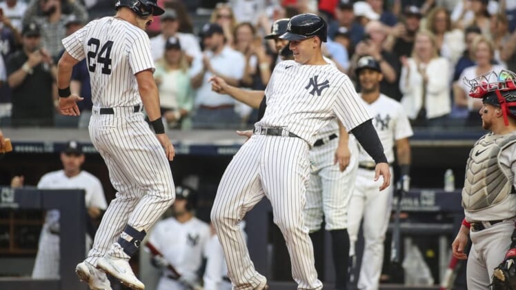 Jul 16, 2022; Bronx, New York, USA; New York Yankees right fielder Matt Carpenter (24) celebrates with first baseman Anthony Rizzo (48) after hitting a three run home run in the first inning against the Boston Red Sox at Yankee Stadium. Mandatory Credit: Wendell Cruz-USA TODAY Sports