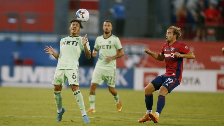 Jul 16, 2022; Frisco, Texas, USA; Austin FC midfielder Daniel Pereira (6) heads the ball against FC Dallas midfielder Paxton Pomykal (19) at Toyota Stadium. Mandatory Credit: Tim Heitman-USA TODAY Sports