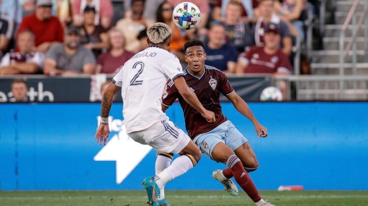 Jul 16, 2022; Commerce City, Colorado, USA; Colorado Rapids midfielder Jonathan Lewis (7) fields the ball ahead of LA Galaxy defender Julian Araujo (2) in the first half at Dick's Sporting Goods Park. Mandatory Credit: Isaiah J. Downing-USA TODAY Sports