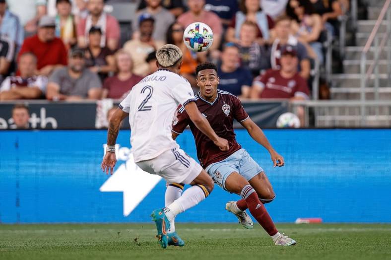 Jul 16, 2022; Commerce City, Colorado, USA; Colorado Rapids midfielder Jonathan Lewis (7) fields the ball ahead of LA Galaxy defender Julian Araujo (2) in the first half at Dick's Sporting Goods Park. Mandatory Credit: Isaiah J. Downing-USA TODAY Sports