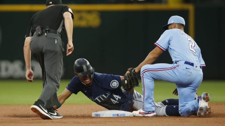 Jul 17, 2022; Arlington, Texas, USA;  Texas Rangers second baseman Marcus Semien (2) tags out Seattle Mariners center fielder Julio Rodriguez (44) as he attempts to steal second base in the first inning at Globe Life Field. Mandatory Credit: Tim Heitman-USA TODAY Sports
