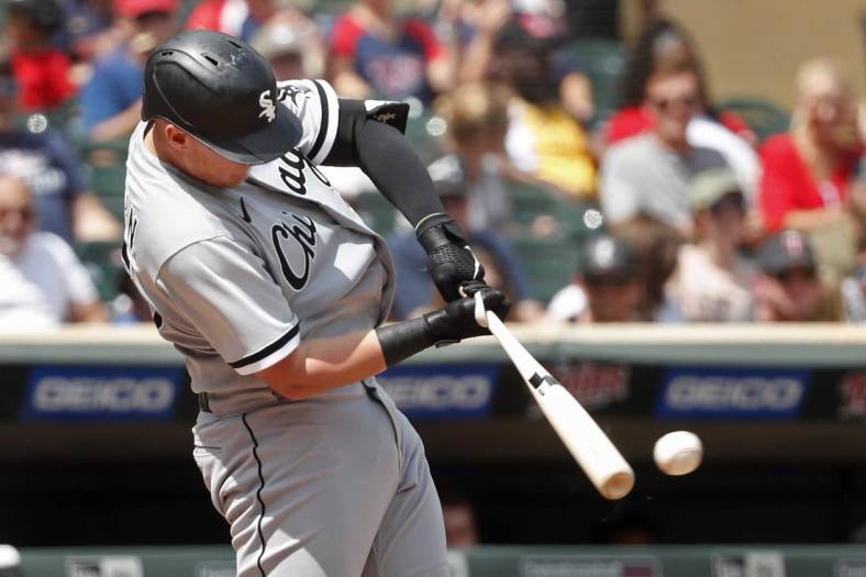 Jul 17, 2022; Minneapolis, Minnesota, USA; Chicago White Sox first baseman Andrew Vaughn (25) hits a two run RBI double against the Minnesota Twins in the fifth inning at Target Field. Mandatory Credit: Bruce Kluckhohn-USA TODAY Sports