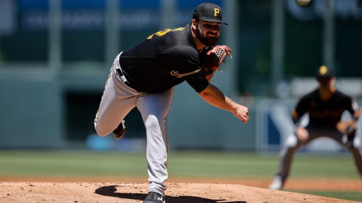 Jul 17, 2022; Denver, Colorado, USA; Pittsburgh Pirates starting pitcher Bryse Wilson (32) pitches in the first inning against the Colorado Rockies at Coors Field. Mandatory Credit: Isaiah J. Downing-USA TODAY Sports