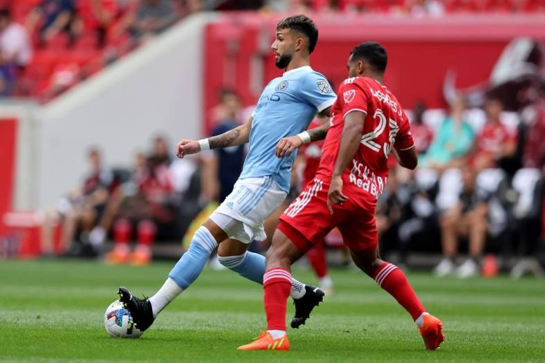 Jul 17, 2022; Harrison, New Jersey, USA; New York City midfielder Valentin Castellanos (11) controls the ball against New York Red Bulls midfielder Cristian Casseres Jr (23) during the first half at Red Bull Arena. Mandatory Credit: Brad Penner-USA TODAY Sports