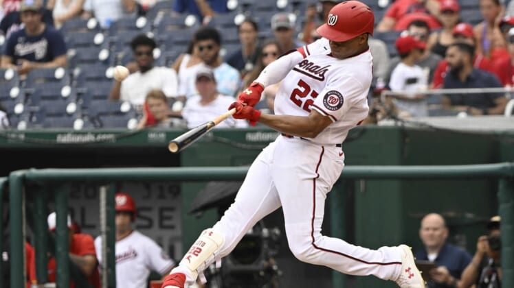 Jul 17, 2022; Washington, District of Columbia, USA;  Washington Nationals right fielder Juan Soto (22) hits a solo home run against the Atlanta Braves during the eighth inning at Nationals Park. Mandatory Credit: James A. Pittman-USA TODAY Sports