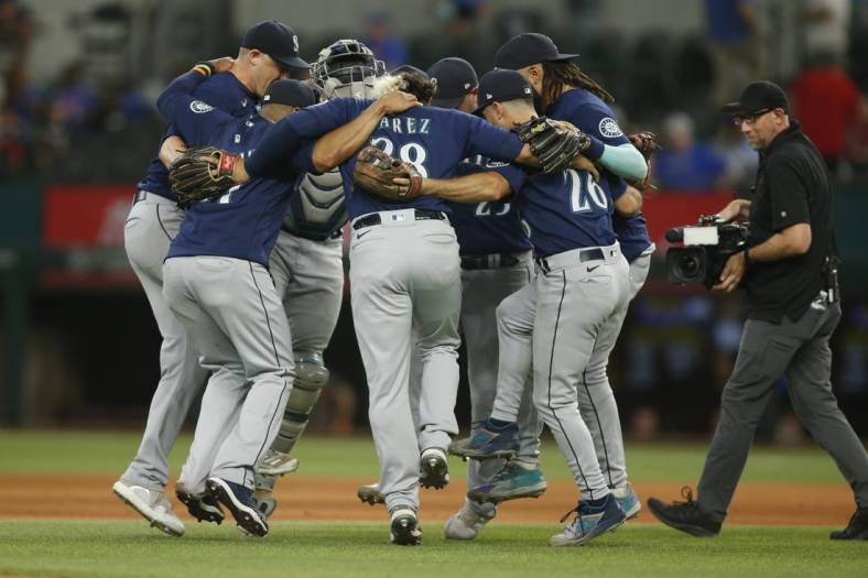 Jul 17, 2022; Arlington, Texas, USA; Seattle Mariners players celebrate after winning the game against the Texas Rangers at Globe Life Field. Mandatory Credit: Tim Heitman-USA TODAY Sports