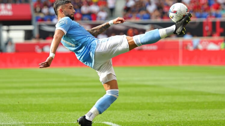 Jul 17, 2022; Harrison, New Jersey, USA; New York City FC midfielder Valentin Castellanos (11) kicks the ball against the New York Red Bulls during the second half at Red Bull Arena. Mandatory Credit: Vincent Carchietta-USA TODAY Sports