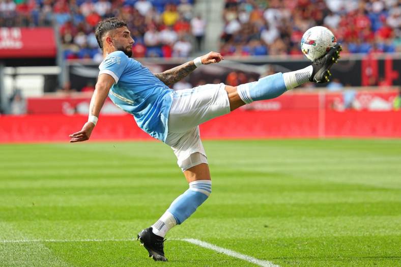 Jul 17, 2022; Harrison, New Jersey, USA; New York City FC midfielder Valentin Castellanos (11) kicks the ball against the New York Red Bulls during the second half at Red Bull Arena. Mandatory Credit: Vincent Carchietta-USA TODAY Sports