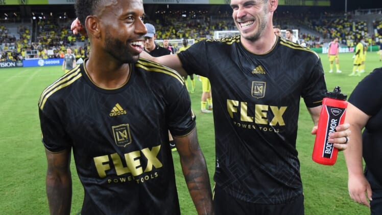 Jul 17, 2022; Nashville, Tennessee, USA; Los Angeles FC forward Gareth Bale (11) celebrates with midfielder Kellyn Acosta (23) after a win against the Nashville SC at Geodis Park. Mandatory Credit: Christopher Hanewinckel-USA TODAY Sports