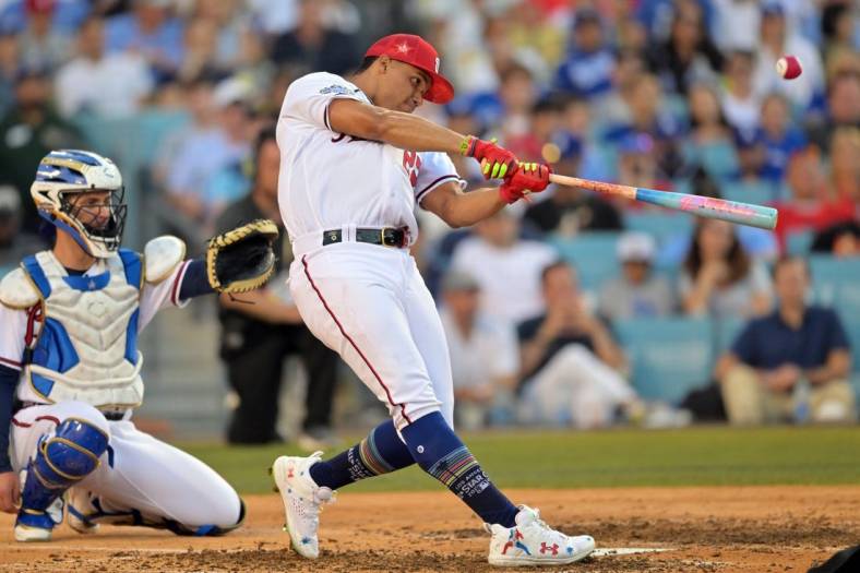 Jul 18, 2022; Los Angeles, CA, USA; Washington Nationals right fielder Juan Soto (22) hits in the final round during the 2022 Home Run Derby at Dodgers Stadium. Mandatory Credit: Jayne Kamin-Oncea-USA TODAY Sports