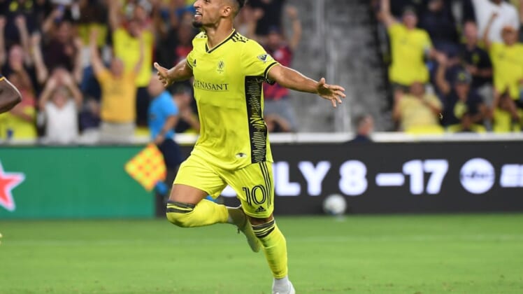 Jul 13, 2022; Nashville, Tennessee, USA; Nashville SC midfielder Hany Mukhtar (10) celebrates after a goal during the first half against the Seattle Sounders at GEODIS Park. Mandatory Credit: Christopher Hanewinckel-USA TODAY Sports