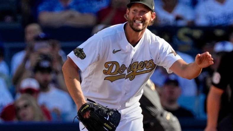 Jul 19, 2022; Los Angeles, California, USA; National League starting pitcher Clayton Kershaw (22) of the Los Angeles Dodgers reacts after giving up a single to American League pitcher/designated hitter Shohei Ohtani (17) of the Los Angeles Angels during the first inning in the 2022 MLB All Star Game at Dodger Stadium. Mandatory Credit: Robert Hanashiro-USA TODAY Sports