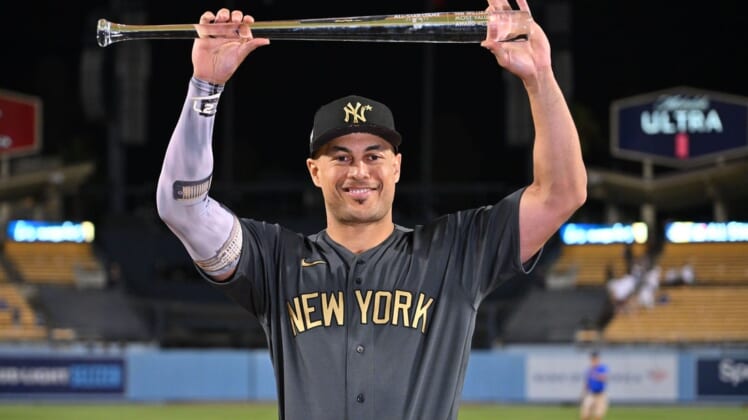 Jul 19, 2022; Los Angeles, California, USA; American League outfielder Giancarlo Stanton (27) of the New York Yankees celebrates after being named Ted Williams most valuable player of the 2022 All Star game at Dodger Stadium. Mandatory Credit: Jayne Kamin-Oncea-USA TODAY Sports
