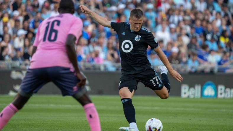 Jul 20, 2022; Minneapolis, MN, USA; Minnesota United midfielder Robin Lod (17) shoots as Everton midfielder Abdoulaye Doucoure (16) defends in the first half at Allianz Field. Mandatory Credit: Matt Blewett-USA TODAY Sports