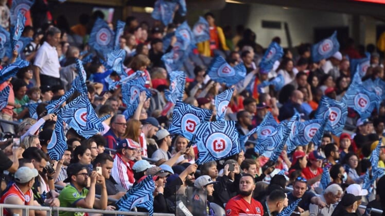 Jul 16, 2022; Chicago, Illinois, USA; Chicago Fire FC fans wave their flags during a match against the Seattle Sounders at Soldier Field. Chicago defeated Seattle 1-0. Mandatory Credit: Jamie Sabau-USA TODAY Sports