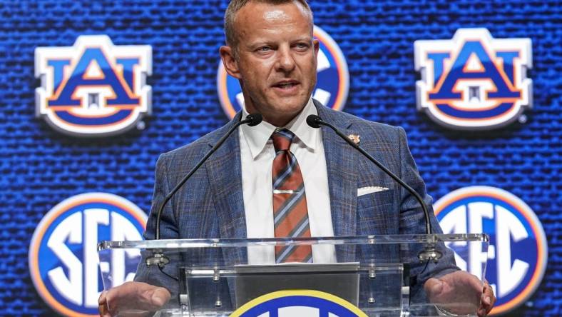 Jul 21, 2022; Atlanta, GA, USA; Auburn Tigers head coach Bryan Harsin shown on the stage during SEC Media Days at the College Football Hall of Fame. Mandatory Credit: Dale Zanine-USA TODAY Sports