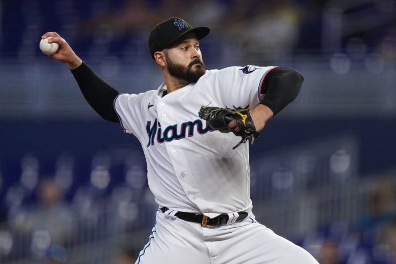 Jul 21, 2022; Miami, Florida, USA; Miami Marlins starting pitcher Pablo Lopez (49) delivers a pitch in the first inning against the Texas Rangers at loanDepot park. Mandatory Credit: Jasen Vinlove-USA TODAY Sports