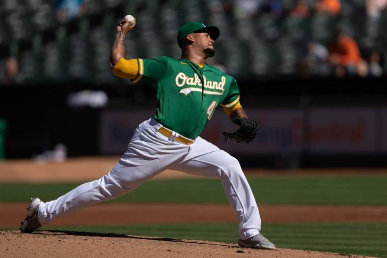 Jul 21, 2022; Oakland, California, USA;  Oakland Athletics starting pitcher Frankie Montas (47) pitches during the first inning against the Detroit Tigers at RingCentral Coliseum. Mandatory Credit: Stan Szeto-USA TODAY Sports