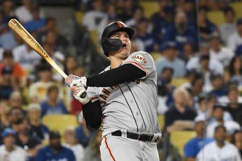 Jul 21, 2022; Los Angeles, California, USA; San Francisco Giants left fielder Joc Pederson (23) hits a double in the eight inning against the Los Angeles Dodgers at Dodger Stadium. Mandatory Credit: Richard Mackson-USA TODAY Sports