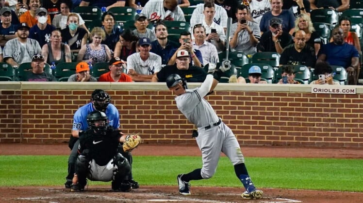 Jul 22, 2022; Baltimore, Maryland, USA;  New York Yankees center fielder Aaron Judge (99) swings through a solo home run against the Baltimore Orioles at Oriole Park at Camden Yards. Mandatory Credit: Tommy Gilligan-USA TODAY Sports
