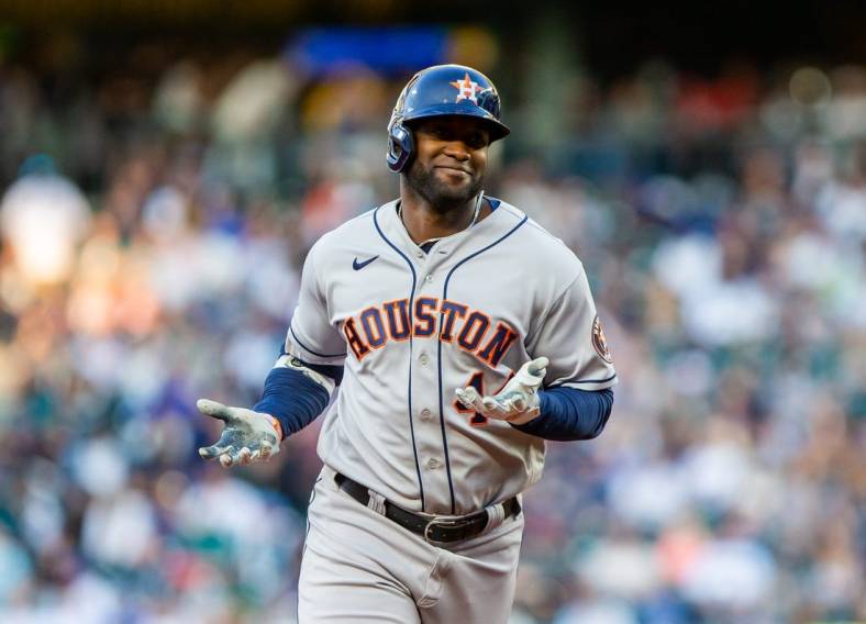 Jul 22, 2022; Seattle, Washington, USA;  Houston Astros designated hitter Yordan Alvarez (44) gestures as he rounds the base after hitting a home run against the Seattle Mariners during the fourth inning at T-Mobile Park. Mandatory Credit: Lindsey Wasson-USA TODAY Sports