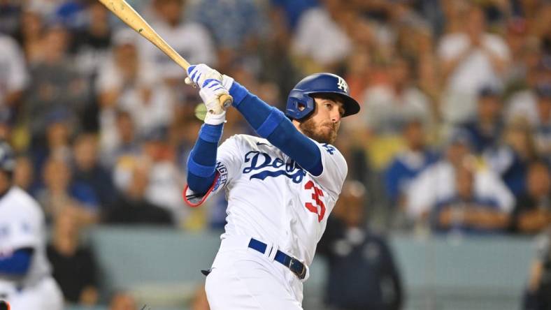 Jul 22, 2022; Los Angeles, California, USA;  Los Angeles Dodgers center fielder Cody Bellinger (35) hits a grand slam home run in the eighth inning against the San Francisco Giants at Dodger Stadium. Mandatory Credit: Jayne Kamin-Oncea-USA TODAY Sports