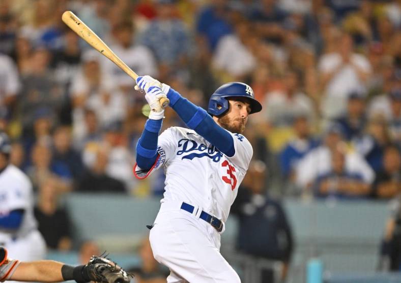 Jul 22, 2022; Los Angeles, California, USA;  Los Angeles Dodgers center fielder Cody Bellinger (35) hits a grand slam home run in the eighth inning against the San Francisco Giants at Dodger Stadium. Mandatory Credit: Jayne Kamin-Oncea-USA TODAY Sports