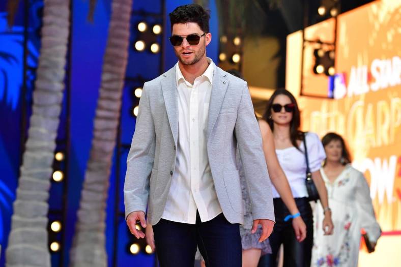 Jul 19, 2022; Los Angeles, CA, USA; American League outfielder Andrew Benintendi (16) of the Kansas City Royals during the Red Carpet Show at L.A. Live. Mandatory Credit: Gary A. Vasquez-USA TODAY Sports